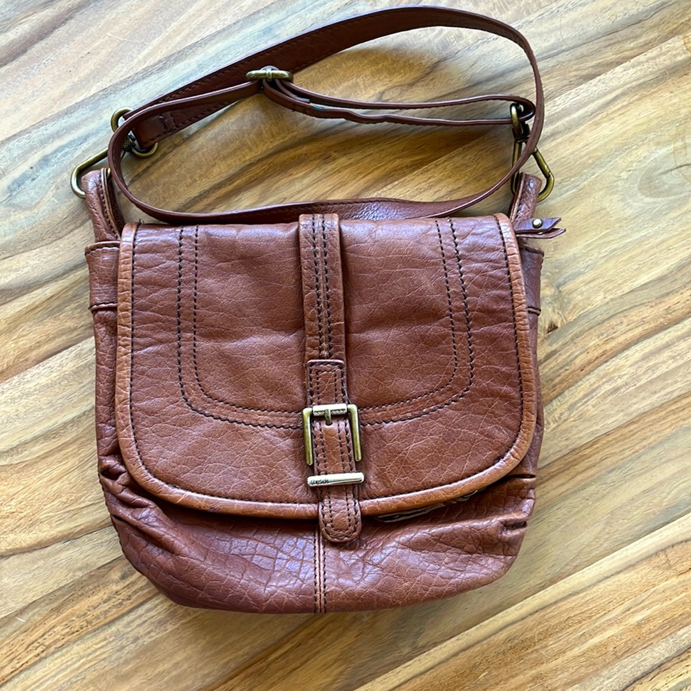 Brown leather crossbody bag from the Sak